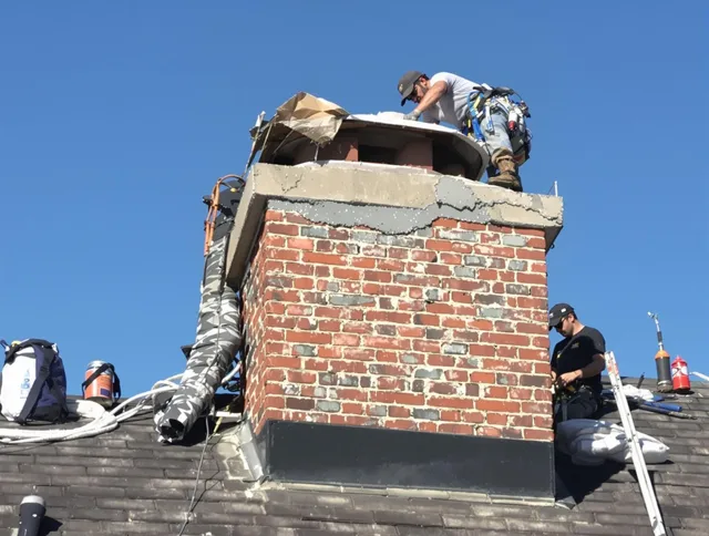 Palm Bay Chimney Sweep installing a custom chimney crown in Palm Bay, FL