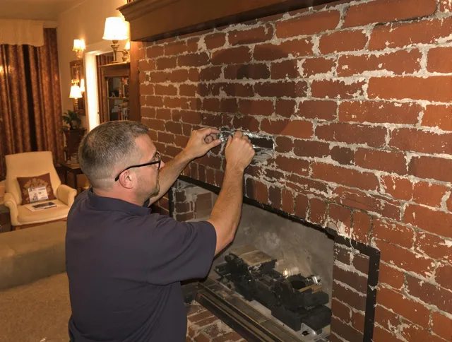 Palm Bay Chimney Sweep expert fixing a fireplace in Palm Bay, FL